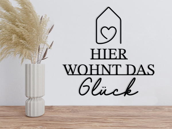 Schriftzug "Hier wohnt das Glück"